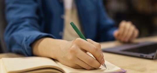 boy-studying-university-library